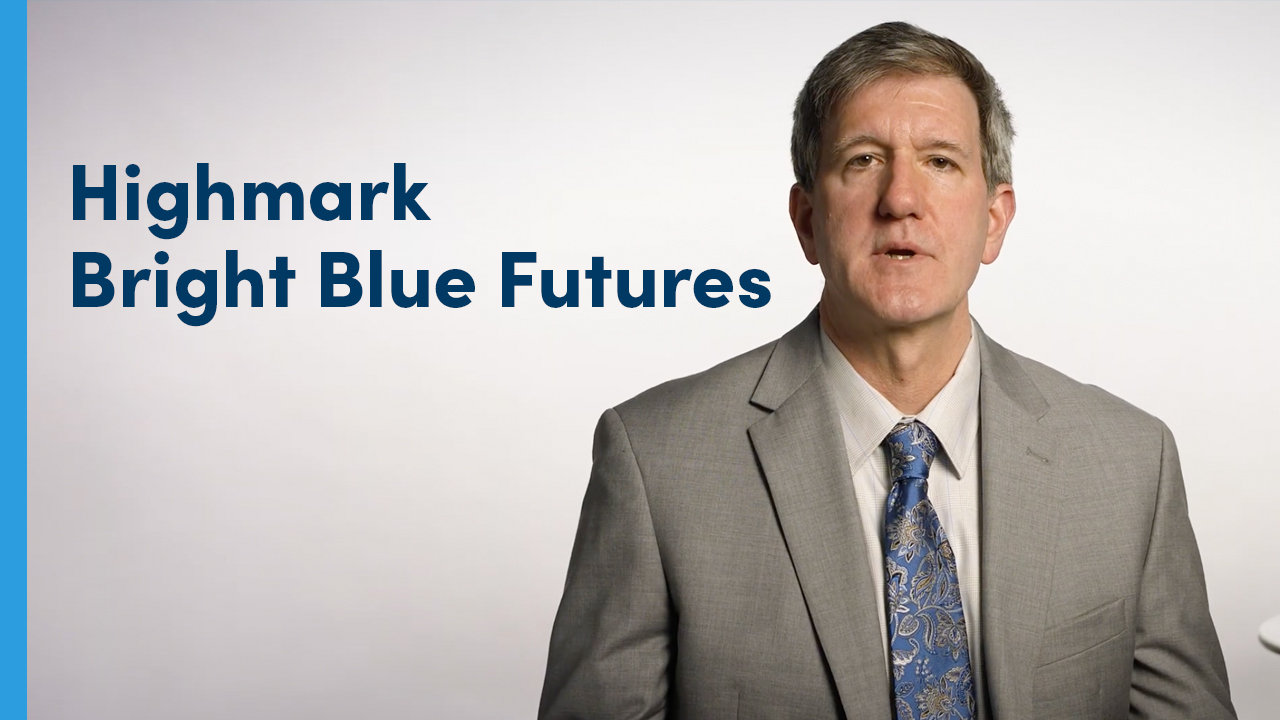 President Tom Doran with Highmark Bright Blue Futures text behind him