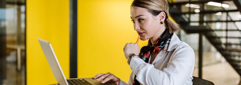 female working on a laptop computer working with a i  chatbots