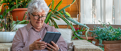 senior women on a Medicare webinar meeting with a tablet device